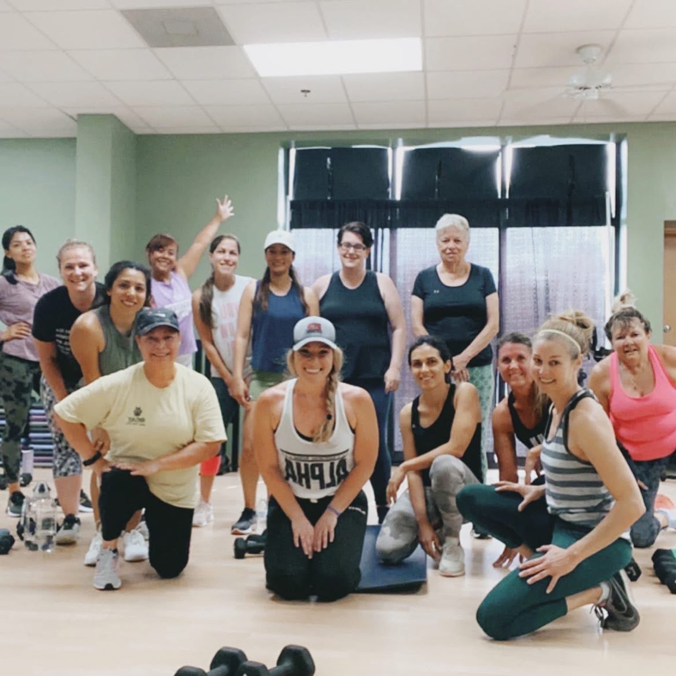 Tricia Martin surrounded by smiling Richmond Hill training clients